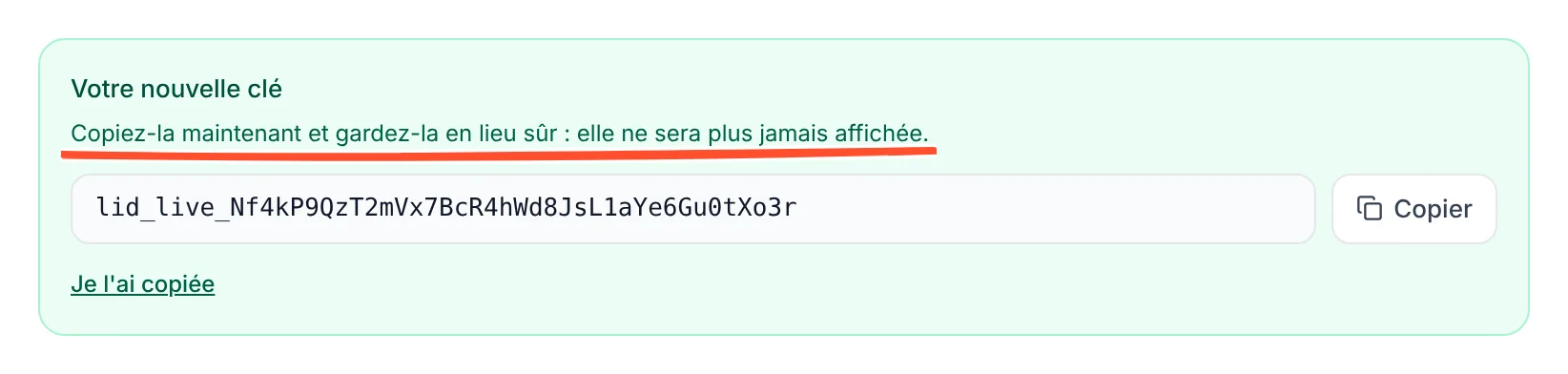Encadré vert Votre nouvelle clé, avec la phrase soulignée Copiez-la maintenant et gardez-la en lieu sûr : elle ne sera plus jamais affichée, une clé d'exemple fictive, le bouton Copier et le lien Je l'ai copiée.